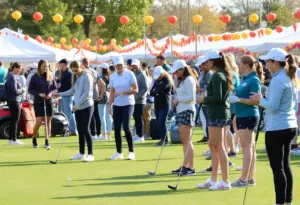 Youth participating in a golf clinic at the Fall Festival.