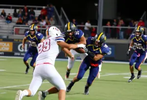 High school football players in action during a game in Southern California