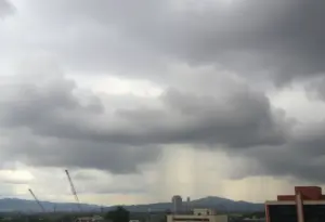 Dark storm clouds over the city of Los Angeles with rain pouring down.