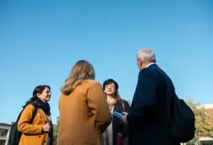 Faculty members discussing on a university campus