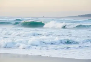 High waves crashing on Southern California beach during advisory
